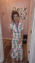 Load and play video in Gallery viewer, White Multi-Colored Floral Design With Pink &amp; Blue V Neckline Trim Maxi Dress
