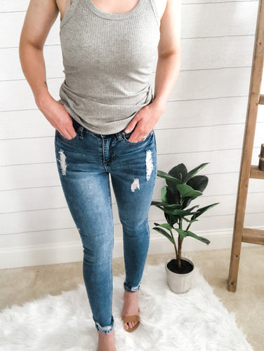 Medium Wash High Rise Distressed Hem Skinny Jean