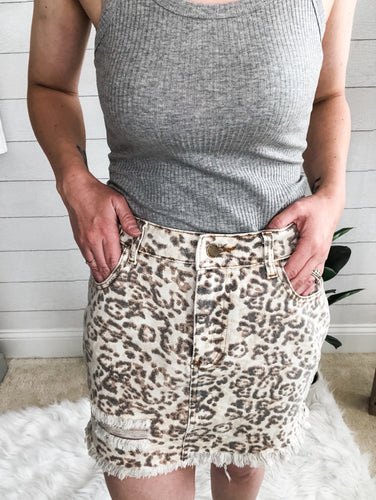 Faded leopard print frayed bottom distressed denim skirt