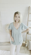 Load and play video in Gallery viewer, Round Neck Front Tassel Tie Top
