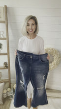 Load and play video in Gallery viewer, Plus Size Faded Leopard Print Distressed Flare Jeans
